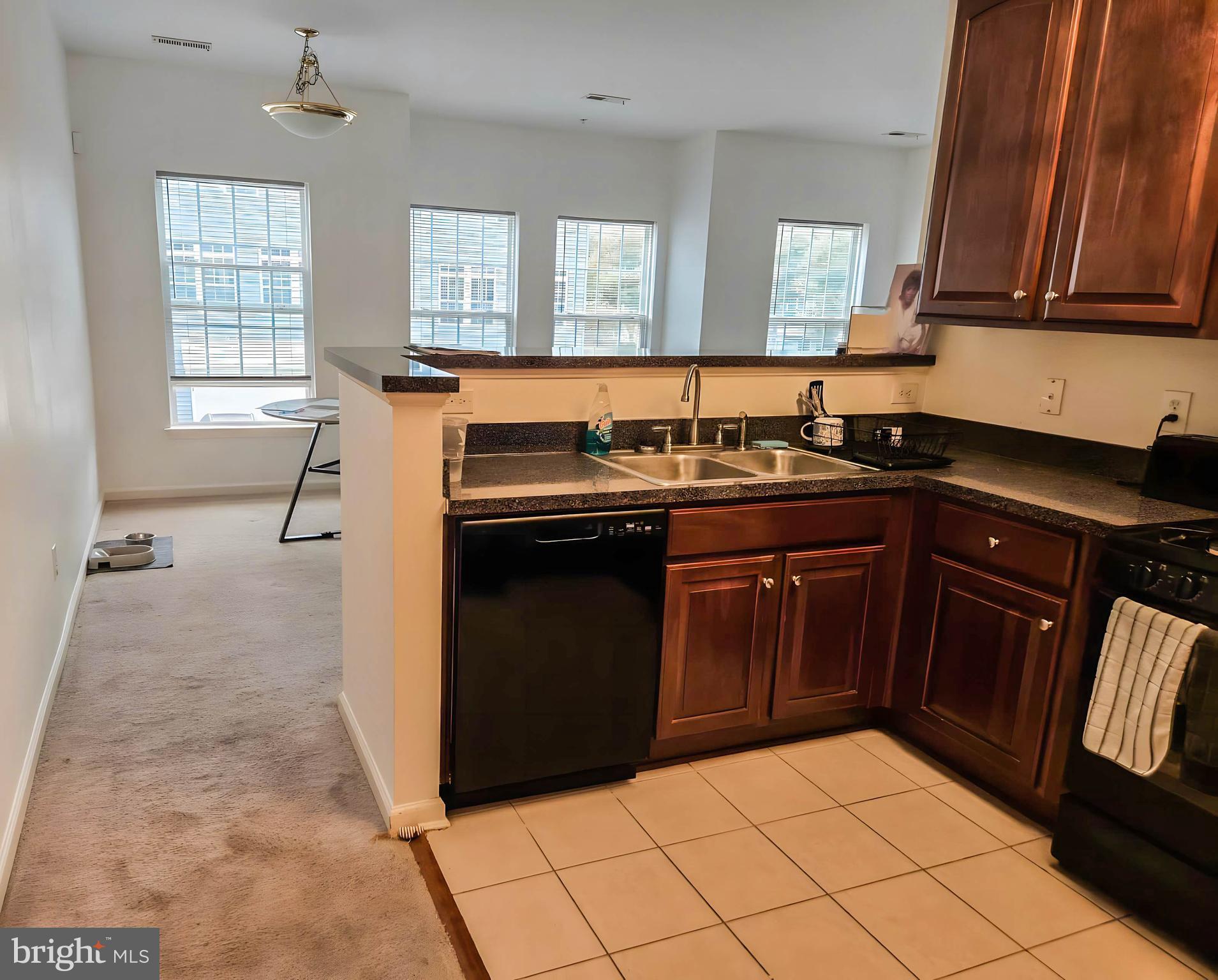 7 Fox Court Riverside, NJ 08075 - Photo 8 of 21 a kitchen with stainless steel appliances granite countertop a stove a sink and a refrigerator