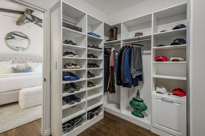 236 Amherst Avenue San Mateo, CA 94402 - Photo 15 of 35 a view of walk in closet with clothes and shoes