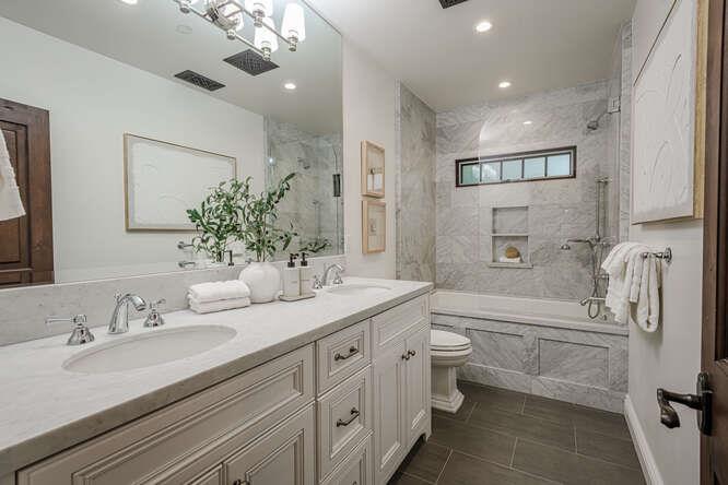 236 Amherst Avenue San Mateo, CA 94402 - Photo 19 of 35 a bathroom with a double vanity sink toilet mirror and bathtub