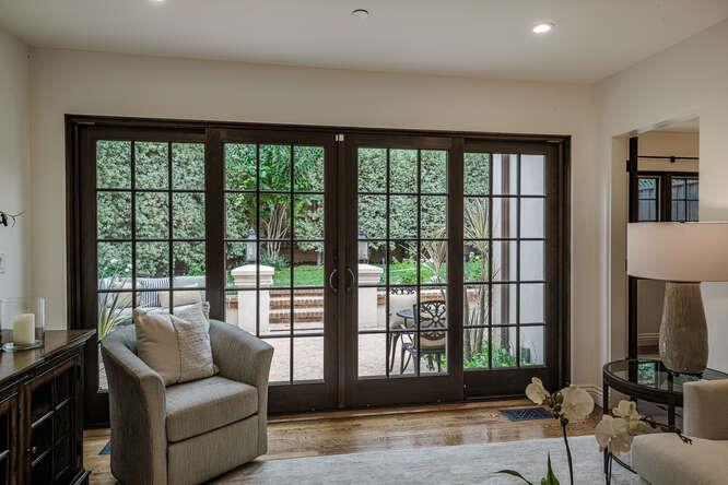 236 Amherst Avenue San Mateo, CA 94402 - Photo 24 of 35 a living room with furniture and a floor to ceiling window