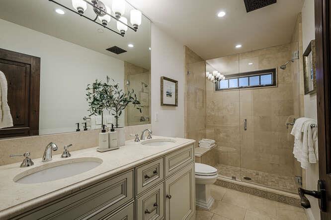 236 Amherst Avenue San Mateo, CA 94402 - Photo 26 of 35 a bathroom with a double vanity sink toilet mirror and shower