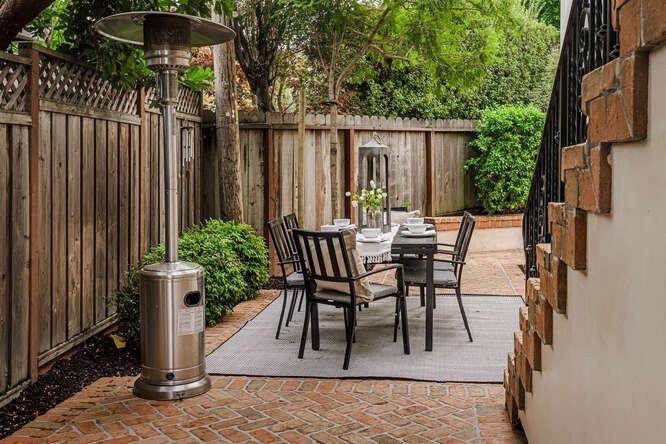236 Amherst Avenue San Mateo, CA 94402 - Photo 33 of 35 a view of a patio with table and chairs and potted plants