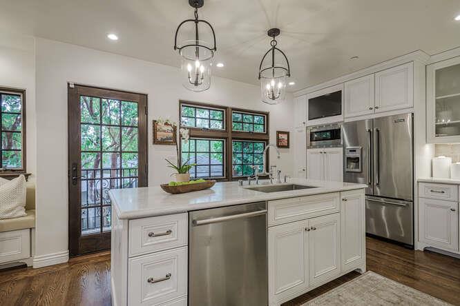 236 Amherst Avenue San Mateo, CA 94402 - Photo 8 of 35 a kitchen with stainless steel appliances granite countertop a sink and dishwasher a refrigerator with wooden floor