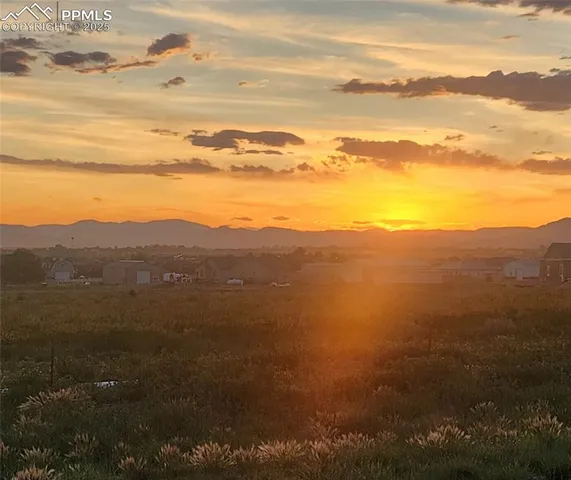 a view of a city with mountains in the background