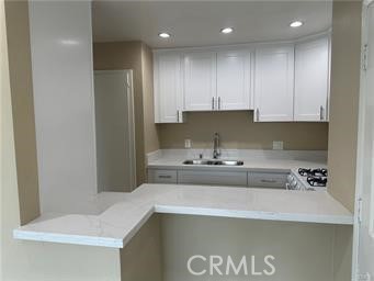 219 East Maple Street, Unit 9 Glendale, CA 91205 - Photo 4 of 13 a kitchen with a sink and cabinets