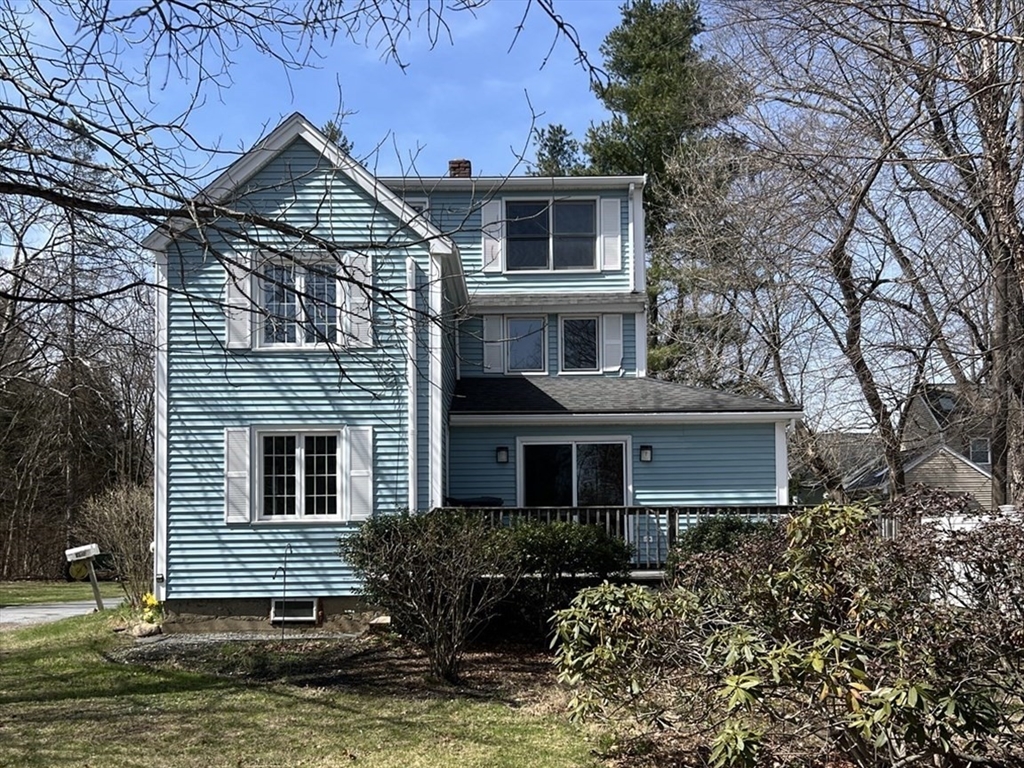 2 Canal Street, Unit A Medway, MA 02053 - Photo 1 of 30 a front view of house with yard and trees around