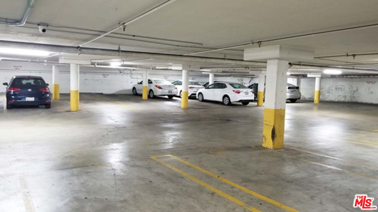 533 South St Andrews Place, Unit 321 Los Angeles, CA 90020 - Photo 15 of 16 a view of parking garage with cars parked