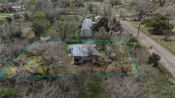 an aerial view of residential house with outdoor space