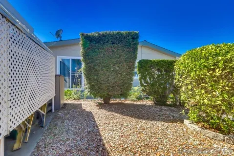 a view of a pathway both side of house