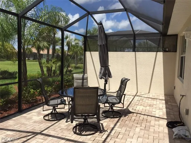 a view of balcony with wooden floor and outdoor seating