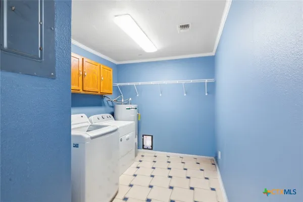 a bathroom with a sink a toilet and a window