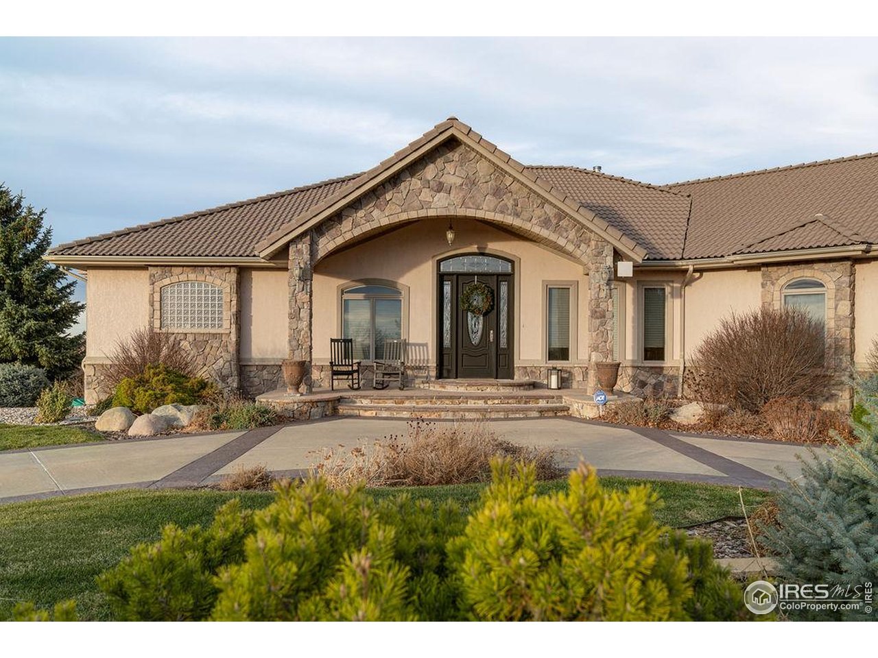 46 Sunset Lane Fort Morgan, CO 80701 - Photo 13 of 49 a view of a house with yard and plants