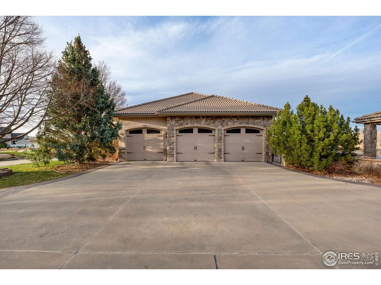46 Sunset Lane Fort Morgan, CO 80701 - Photo 14 of 49 a front view of a house with a yard and garage