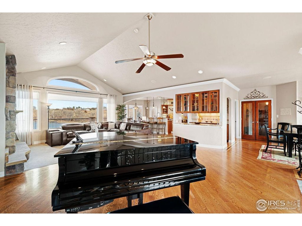 46 Sunset Lane Fort Morgan, CO 80701 - Photo 22 of 49 a living room with furniture a rug and a chandelier
