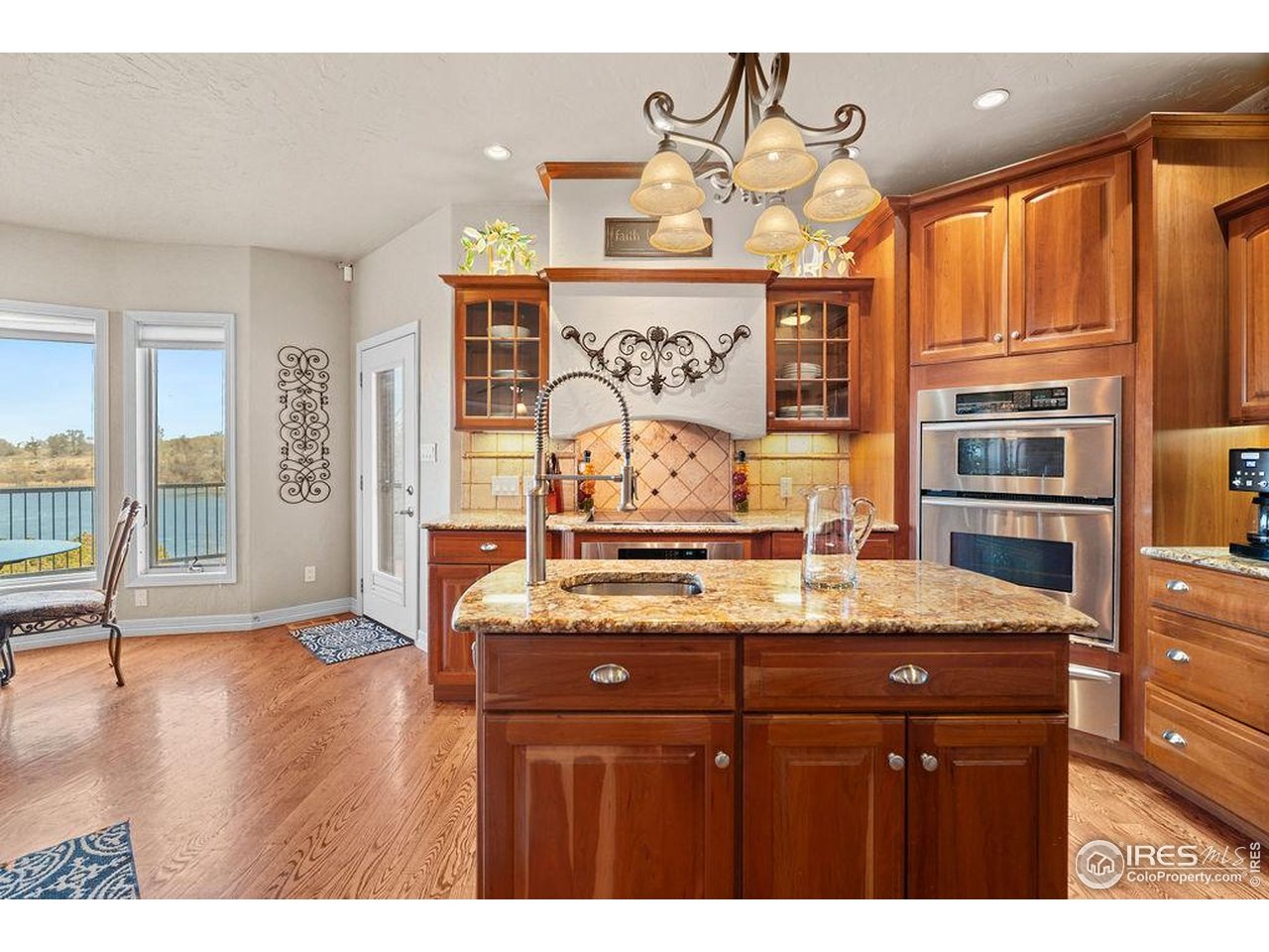 46 Sunset Lane Fort Morgan, CO 80701 - Photo 23 of 49 a kitchen with stainless steel appliances granite countertop a sink and cabinets