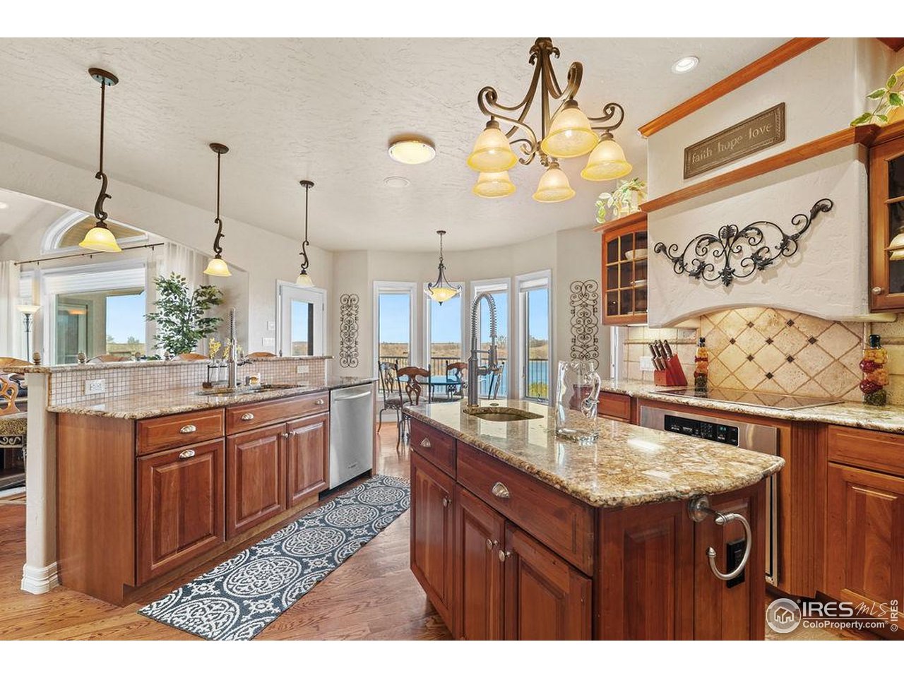 46 Sunset Lane Fort Morgan, CO 80701 - Photo 24 of 49 a kitchen with a sink a counter space and wooden floor