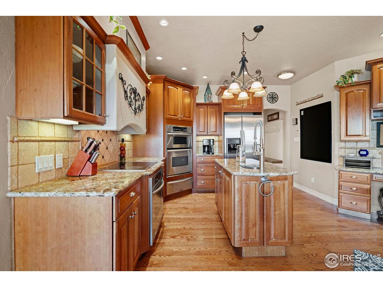 46 Sunset Lane Fort Morgan, CO 80701 - Photo 26 of 49 a kitchen with stainless steel appliances granite countertop a sink and a stove