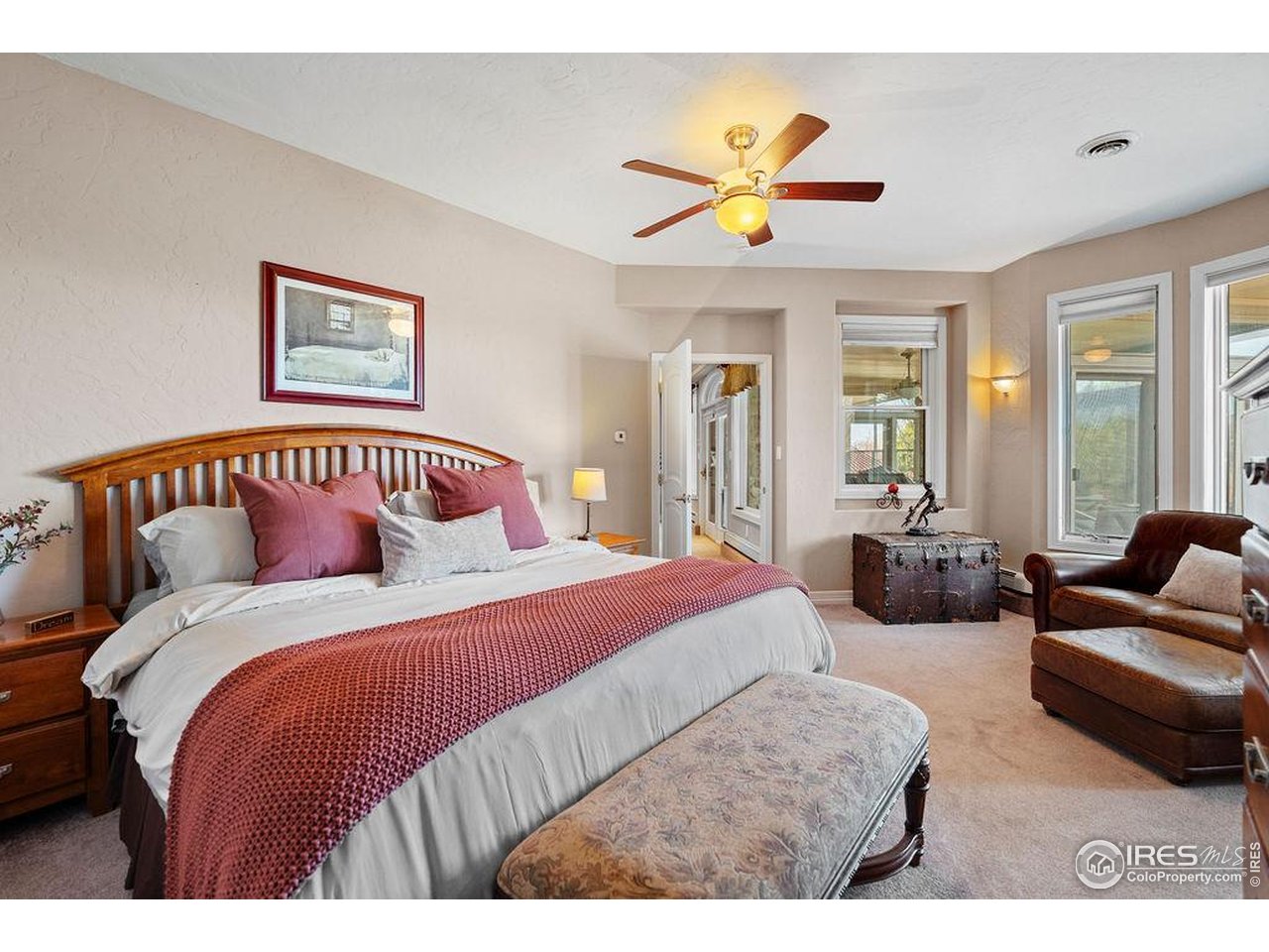 46 Sunset Lane Fort Morgan, CO 80701 - Photo 43 of 49 a bedroom with a large bed and a couch