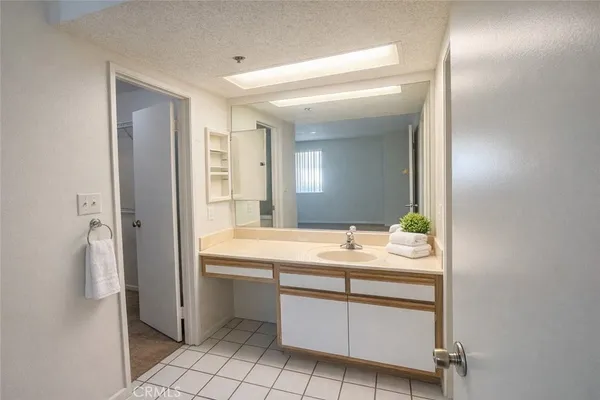 a room with a sink and a mirror