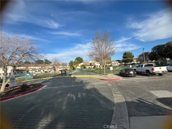 a view of a city street with cars