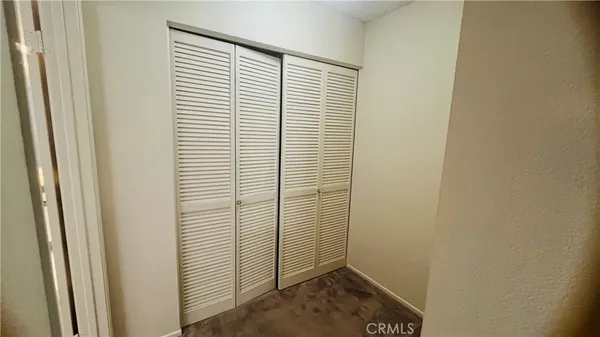 a view of a room that has a window in it