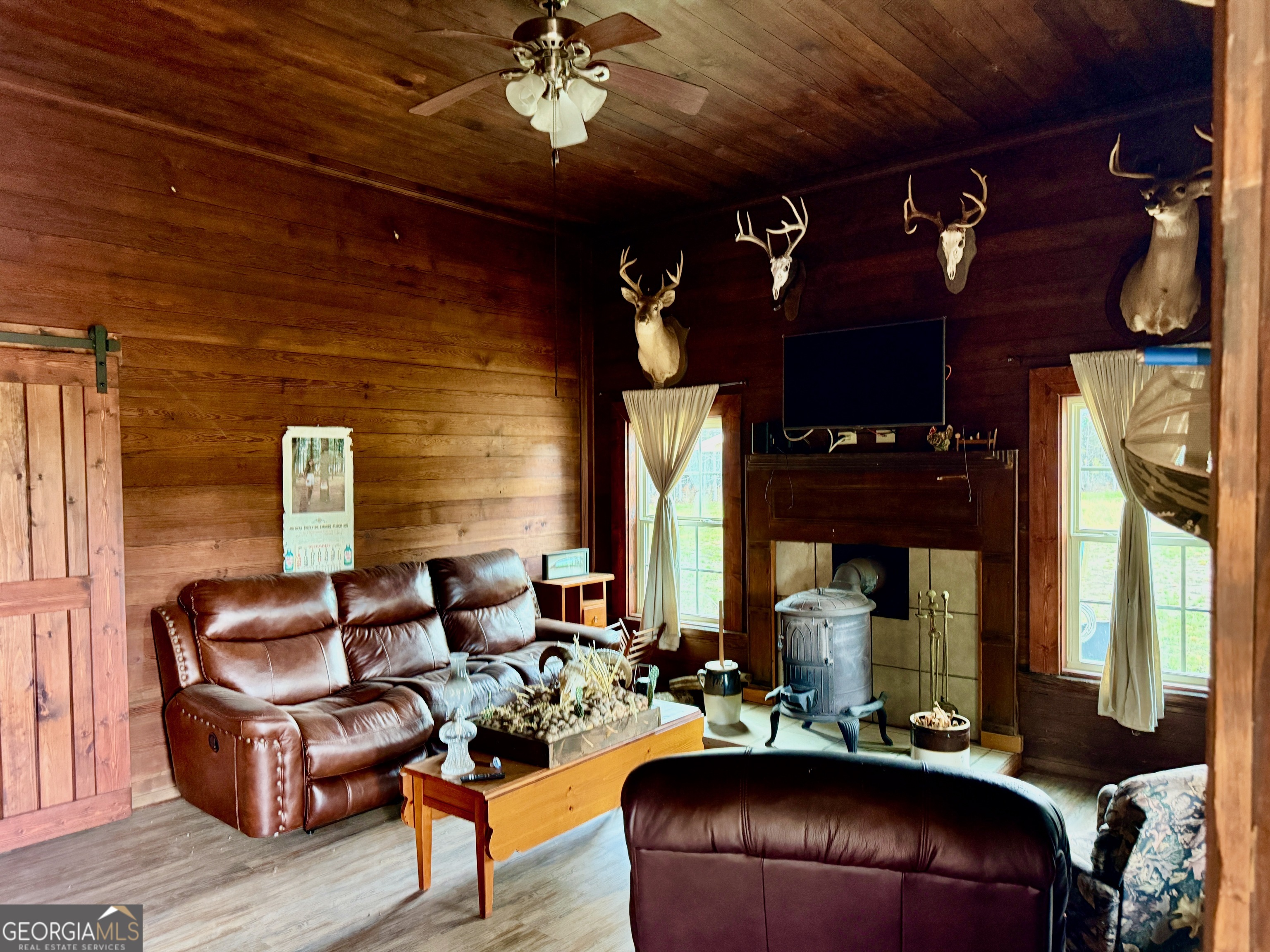 0 Neily Wagon Road McRae-Helena, GA 31055 - Photo 13 of 27 a living room with furniture a lamp and a fireplace