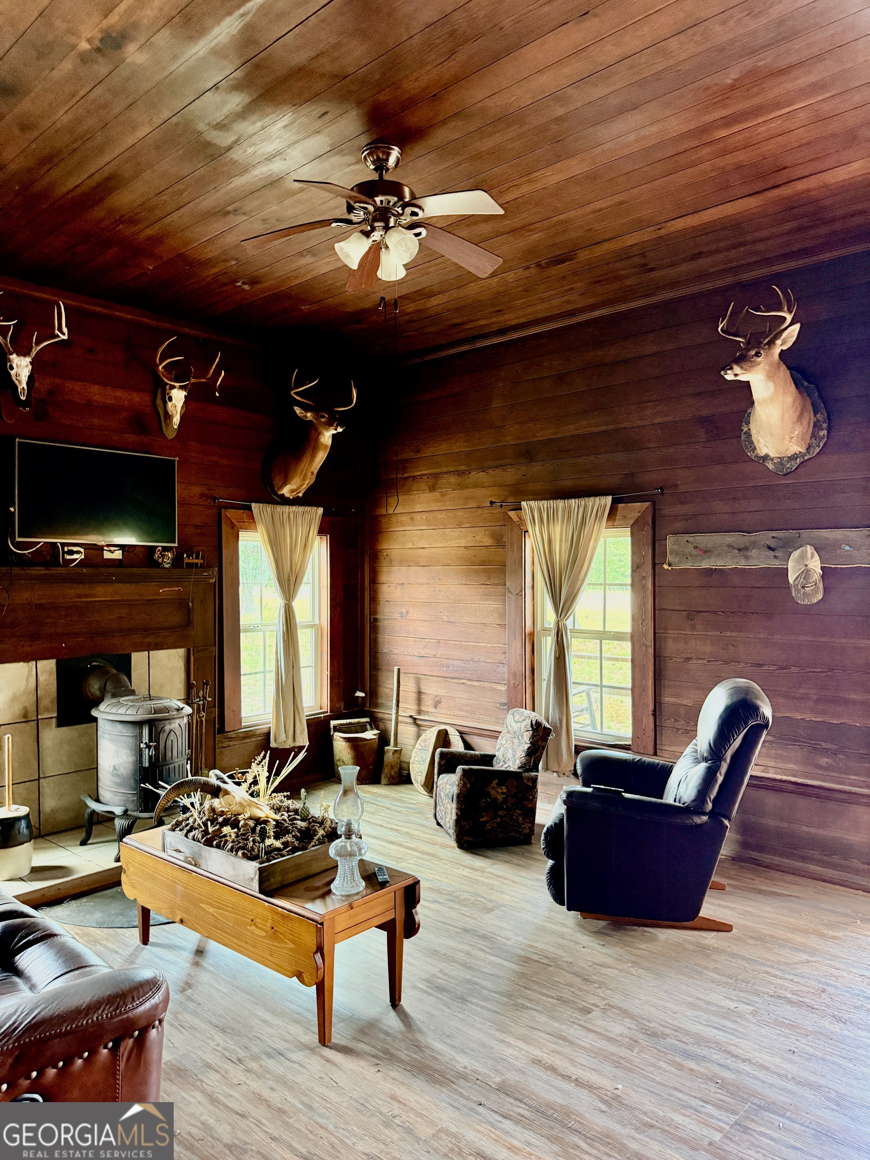 0 Neily Wagon Road McRae-Helena, GA 31055 - Photo 6 of 27 a living room with furniture and a chandelier