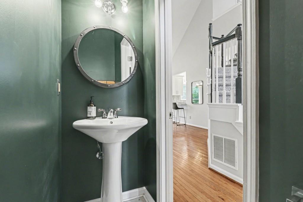 3793 Market Crescent Clarkston, GA 30021 - Photo 21 of 35 a bathroom with a sink and a mirror
