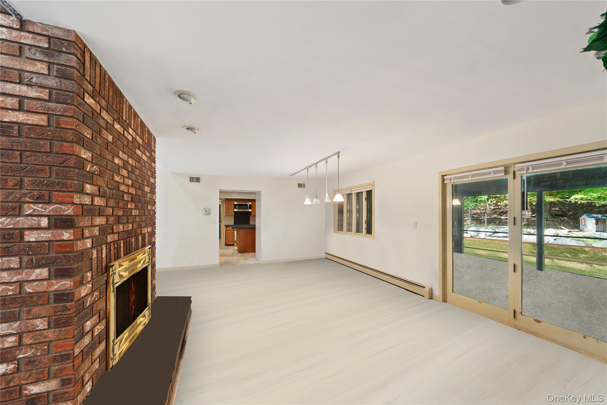 145 Youngblood Road Montgomery, NY 12549 - Photo 11 of 35 a view of an empty room with a fireplace