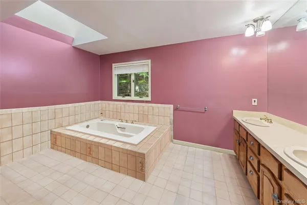 a bathroom with a sink a vanity and a mirror