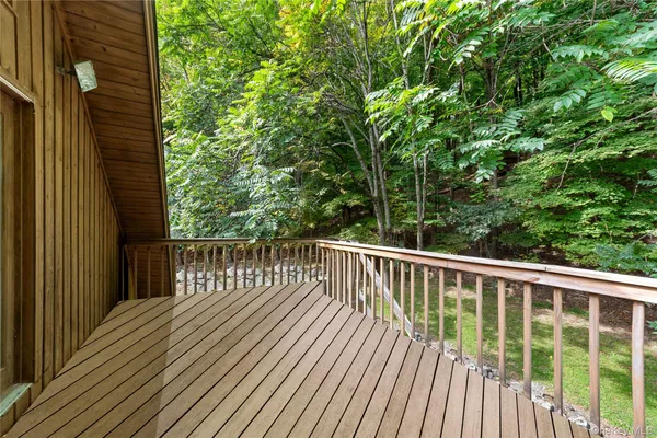 a view of balcony with wooden floor