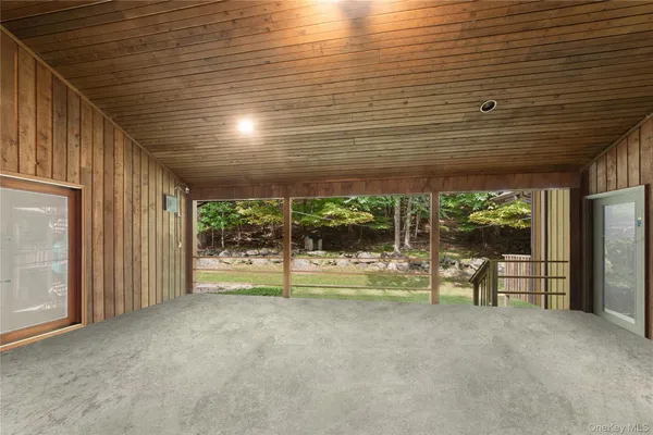 a view of empty room with floor to ceiling window and floor to ceiling window