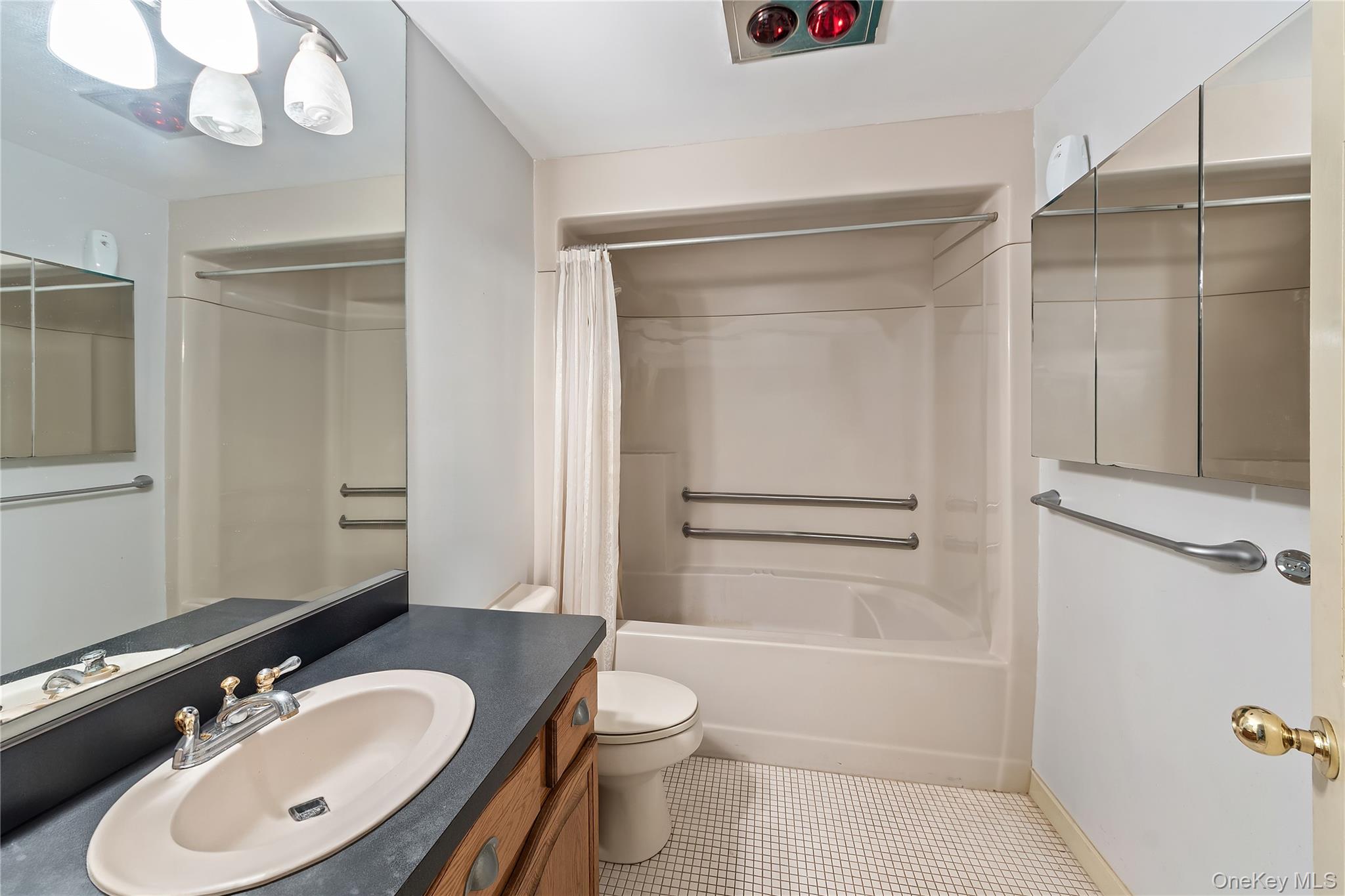 145 Youngblood Road Montgomery, NY 12549 - Photo 6 of 35 a bathroom with a sink a toilet and shower