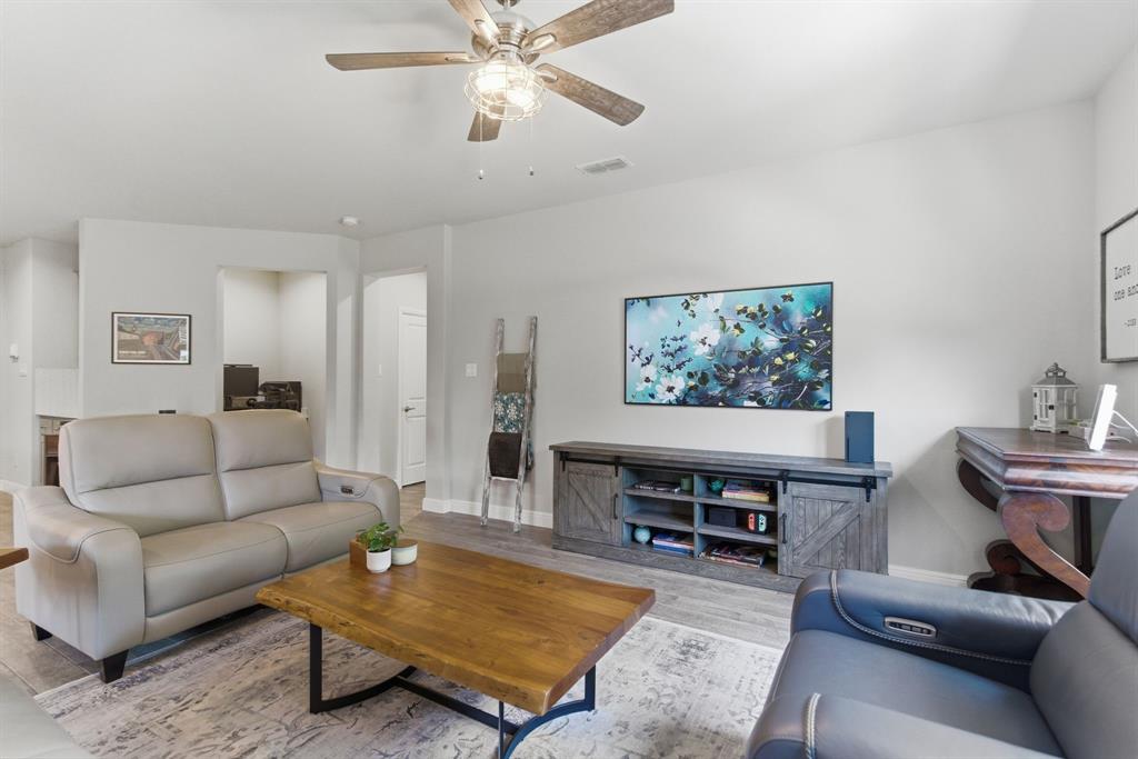 5621 Round Hl Road Denton, TX 76210 - Photo 14 of 27 a living room with furniture and a flat screen tv