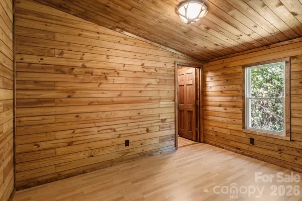 a view of outdoor space with wooden floor