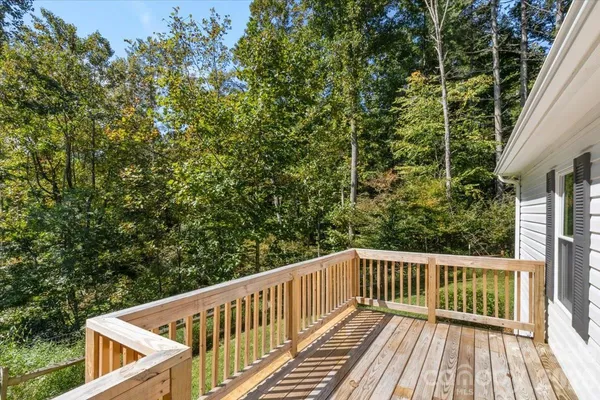 a deck with trees in front of it