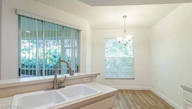 a bath room with a window and a bath tub