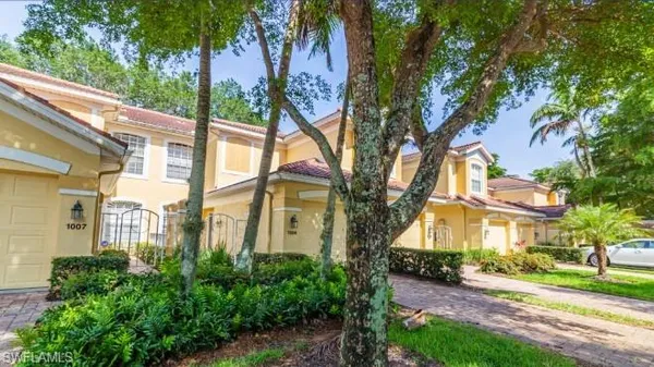 a view of a building with a tree