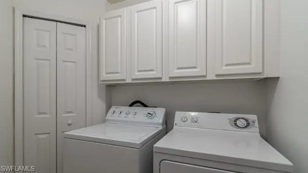 a view of storage and utility room with washer and dryer