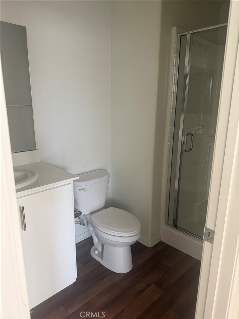 7357 Solstice Place Rancho Cucamonga, CA 91739 - Photo 7 of 12 a white toilet sitting next to a bathroom sink