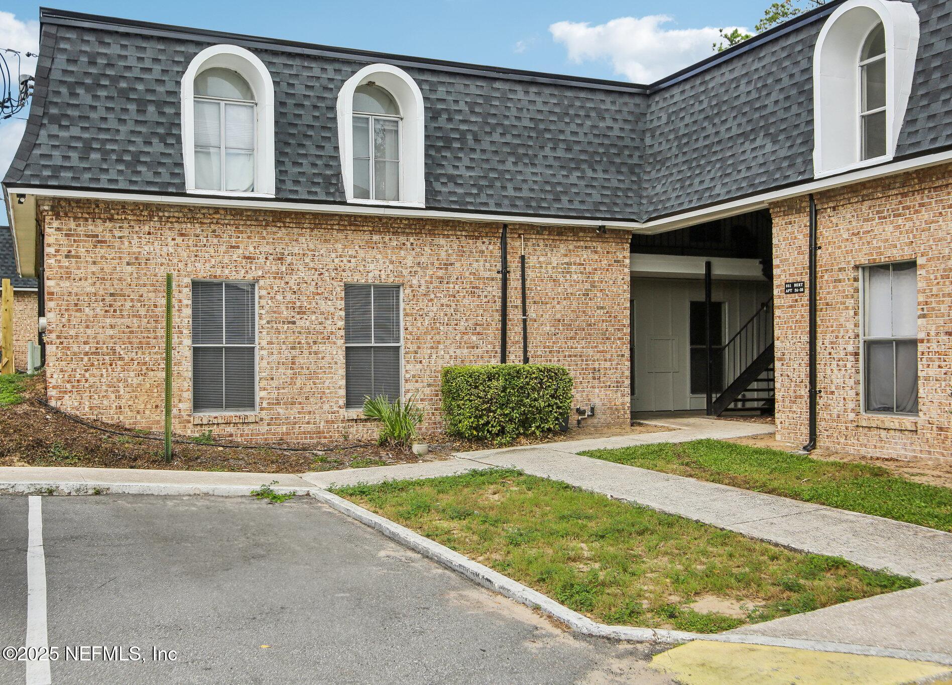 a front view of a house with garden