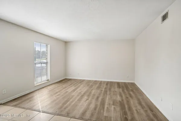 a view of an empty room and window