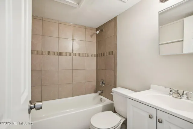 a bathroom with a bathtub toilet and sink