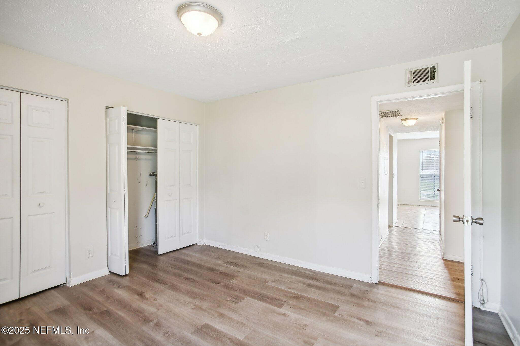 851 Bert Road, Unit 11 Jacksonville, FL 32211 - Photo 20 of 24 wooden floor in an empty room