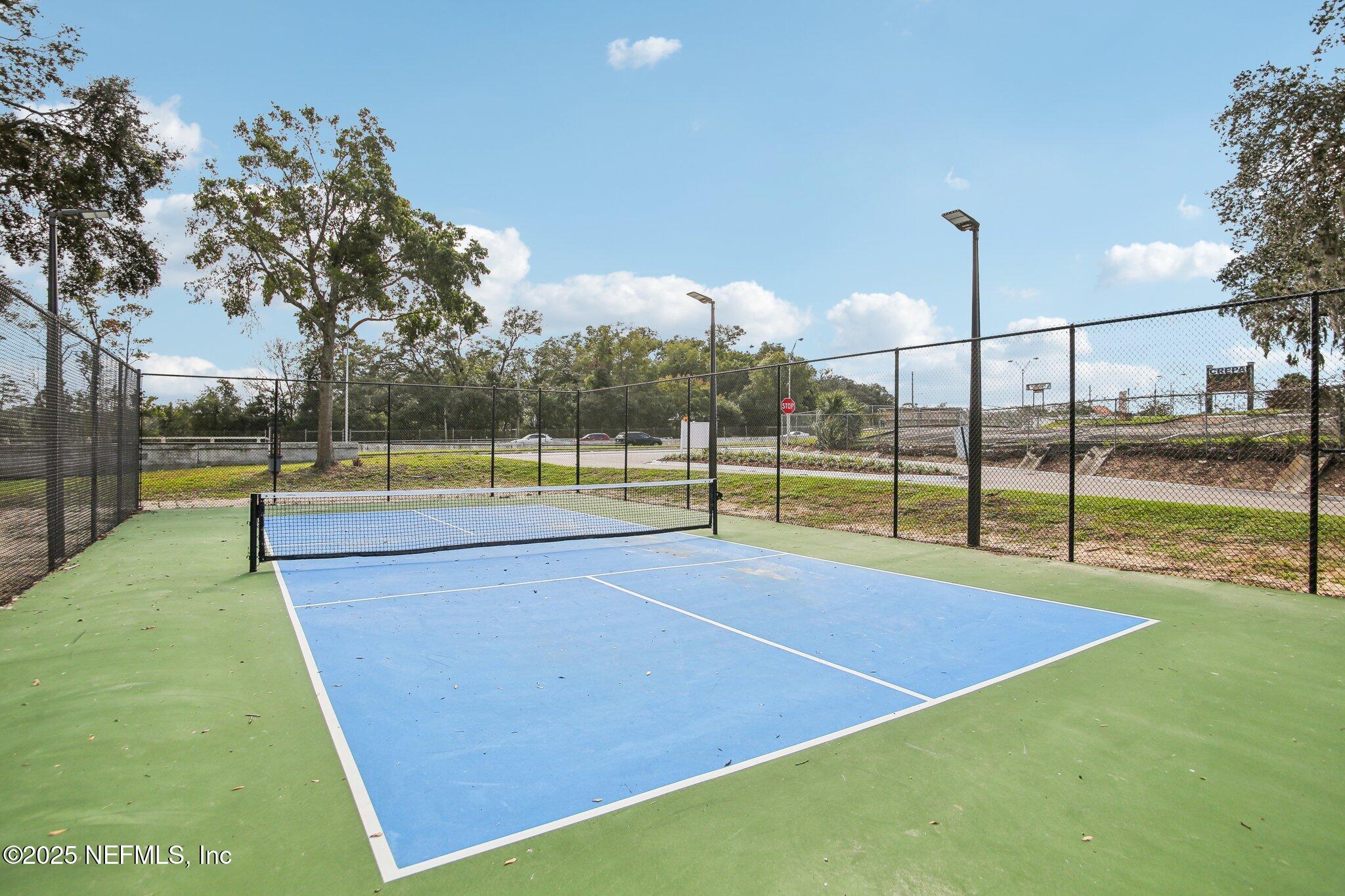 851 Bert Road, Unit 11 Jacksonville, FL 32211 - Photo 23 of 24 a view of a tennis court