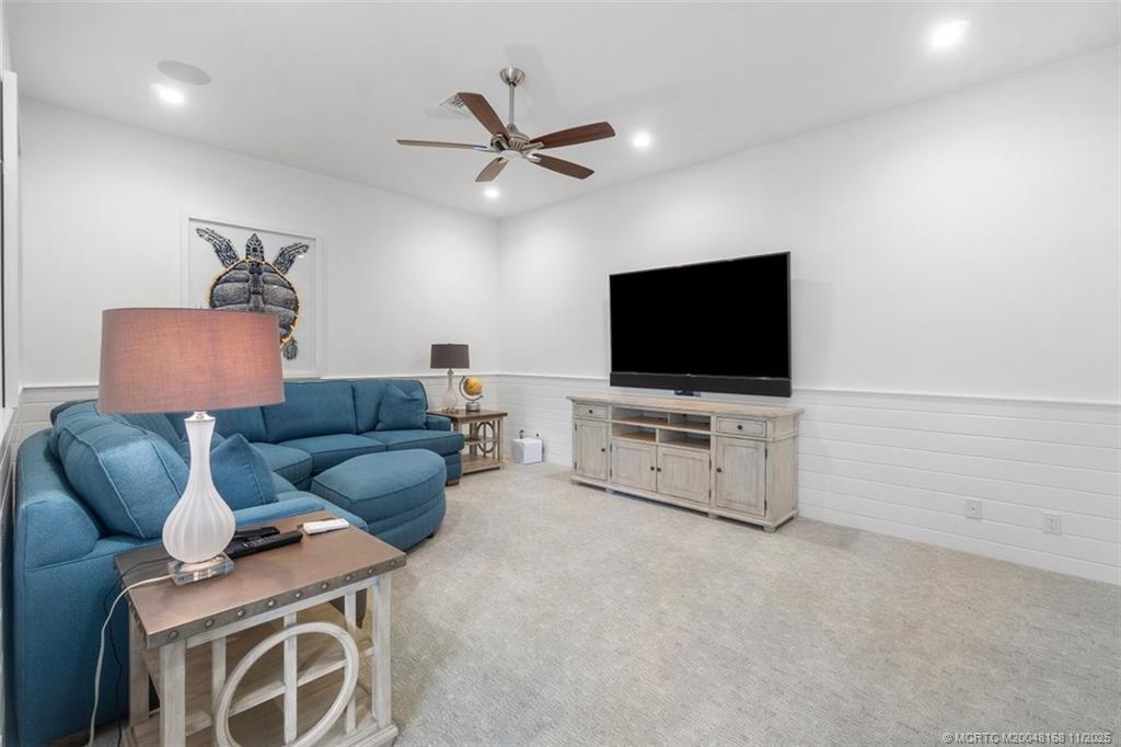 1904 Southeast Sailfish Point Boulevard Stuart, FL 34996 - Photo 29 of 64 a living room with furniture and a flat screen tv