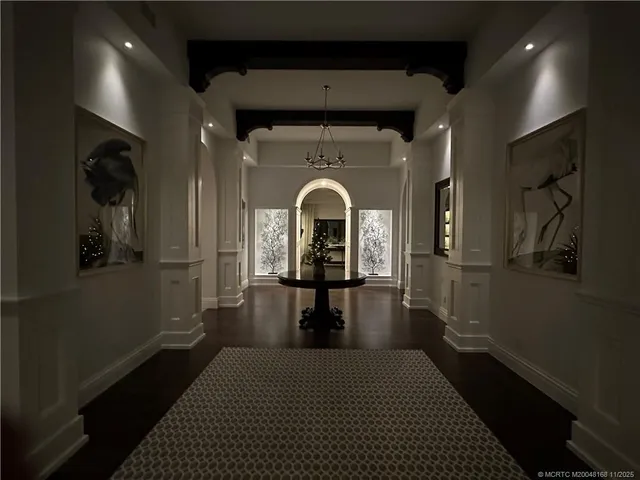 a view of a hallway with a chandelier
