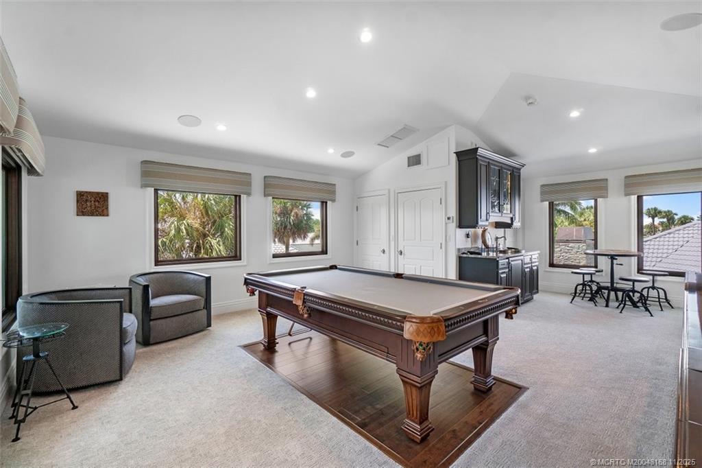 1904 Southeast Sailfish Point Boulevard Stuart, FL 34996 - Photo 37 of 64 a room with furniture pool table and windows