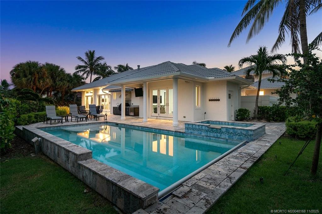 1904 Southeast Sailfish Point Boulevard Stuart, FL 34996 - Photo 44 of 64 a view of a house with swimming pool and a yard