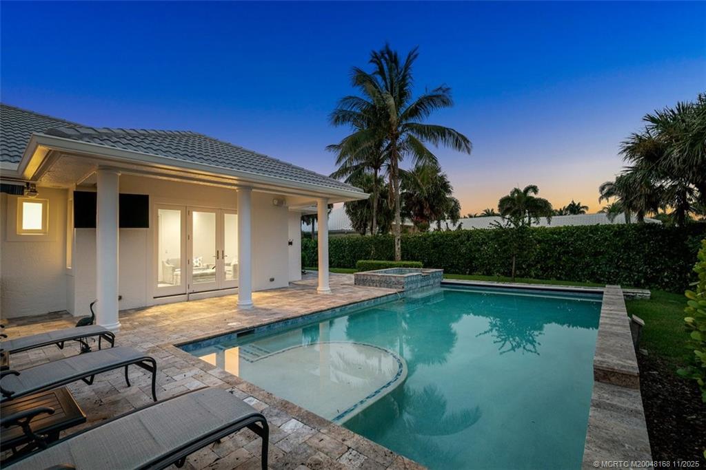 1904 Southeast Sailfish Point Boulevard Stuart, FL 34996 - Photo 45 of 64 a view of a house with swimming pool and sitting area